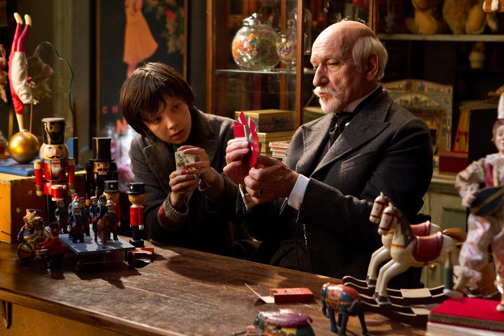 In this image released by Paramount Pictures, Asa Butterfield portrays Hugo Cabret, left, and Ben Kingsley plays Georges Méliès in a scene from "Hugo." (AP Photo/Paramount Pictures, Jaap Buitendijk)